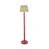 Endon Brenleigh floor lamp with a pink stacked sphere base and green zigzag pleated faux silk shade, shown on a plain white background.
