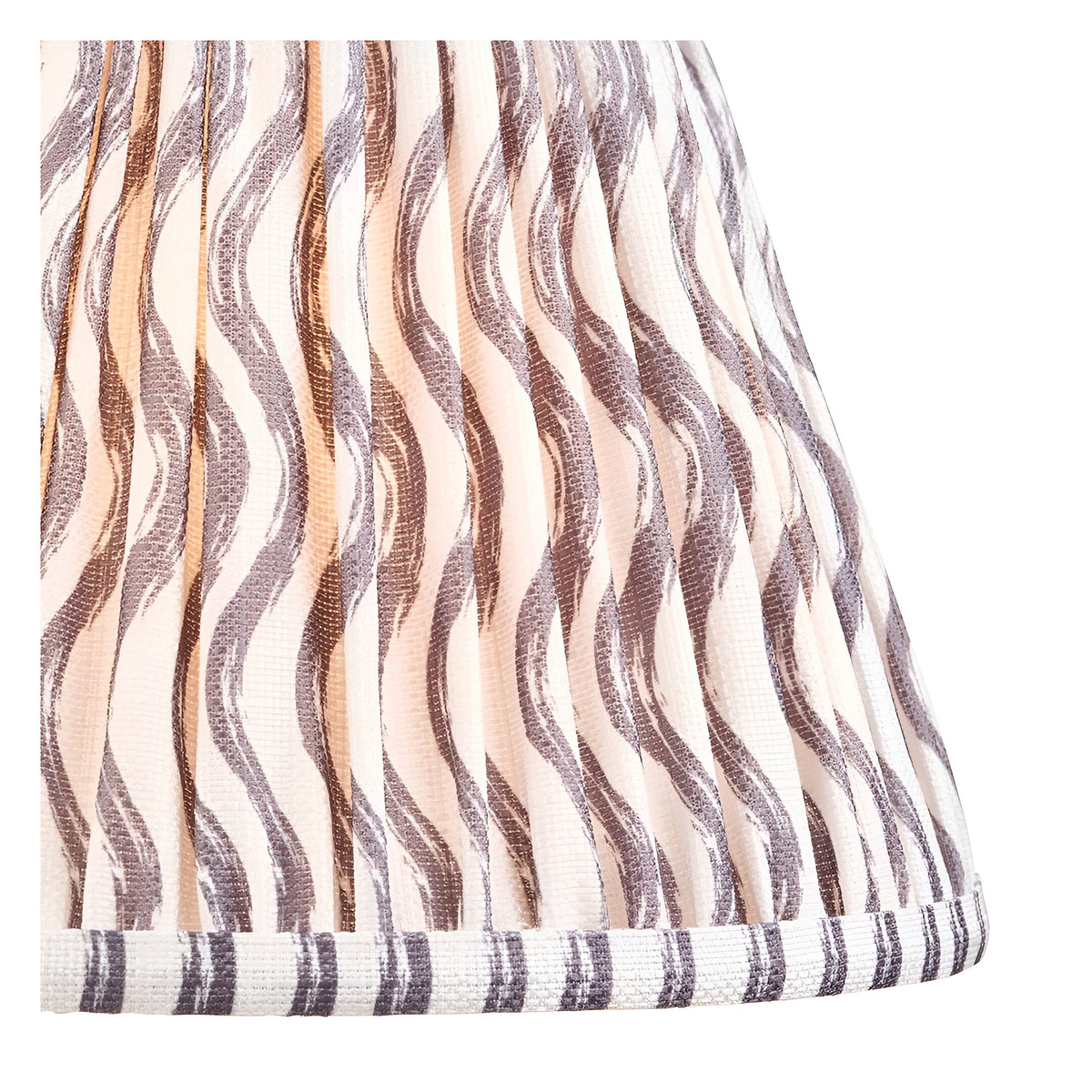 Close-up of the Endon Amberley Ripple table lamp shade, showing hand-pleated faux linen with grey and brass wavy print and taped striped edge.