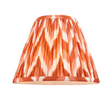 Endon Amberley Zigzag pleated tapered table lamp shade in apricot orange and cream digitally printed faux silk, shown on a plain white background.