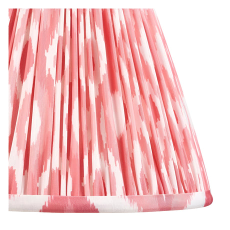 Close-up of the Endon Carlworth Ikat Table Lamp II shade in almond and coral, showing the hand-pleated faux silk fabric with ikat pattern.