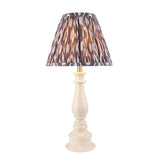 Endon Carlworth Ikat Table Lamp II in almond and grey, with a turned high-gloss resin spindle base and pleated faux silk Ikat shade, on a white background.