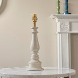 Endon Carlworth Ikat Table Lamp II in almond gloss resin with turned spindle base and brass B22 holder, shown without shade on a marble table.