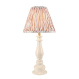 Carlworth Ikat table lamp with turned almond resin spindle base and pleated neutral Ikat shade, brass fittings, on a plain white background.