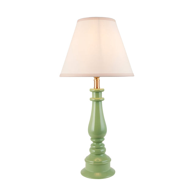 Endon Carlworth Ivy table lamp with a green high gloss turned resin spindle base, brass fitting, and tapered vintage white fabric shade on a plain background.