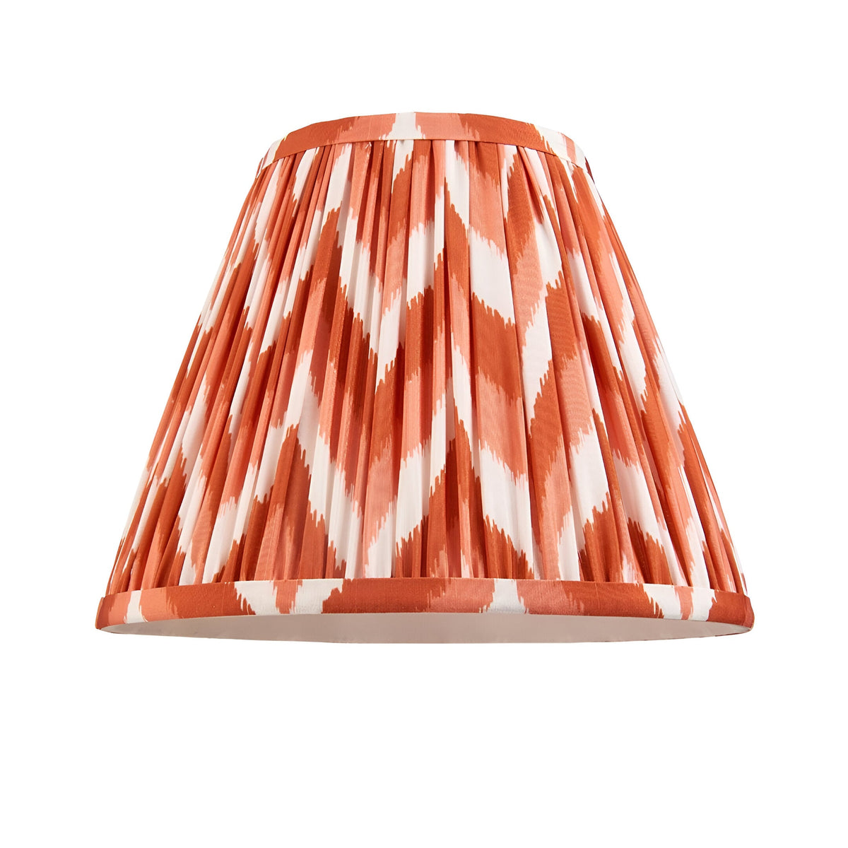 Endon Carlworth pleated tapered lamp shade in orange and white zigzag ikat faux silk with taped edges, shown on a plain white background.