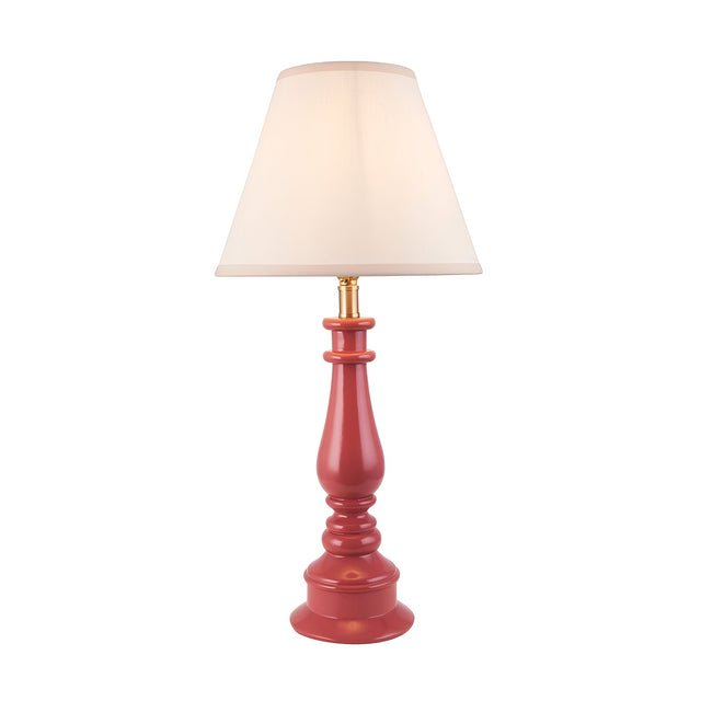 Endon Carlworth Ivy table lamp with a turned pink clay resin spindle base, brass lamp holder and tapered vintage white fabric shade on a plain background.