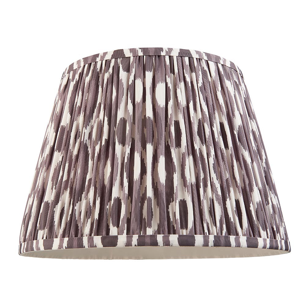 Amberley Ikat Table Lamp shade shown alone, pleated faux silk in grey, brown and cream ikat pattern, on a plain white background.