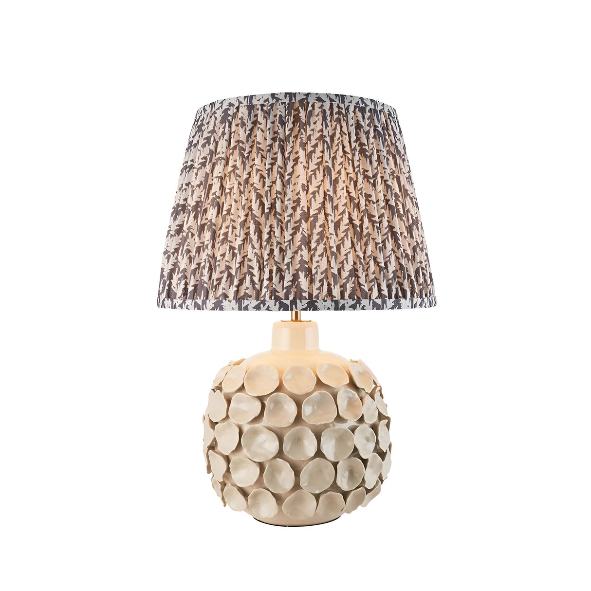 Ashbury Leaf Table Lamp in Grey with a textured ceramic disc base and a pleated tapered shade in grey leaf print, shown on white background.