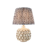 Ashbury Leaf Table Lamp in Grey with a textured ceramic disc base and a pleated tapered shade in grey leaf print, shown on white background.