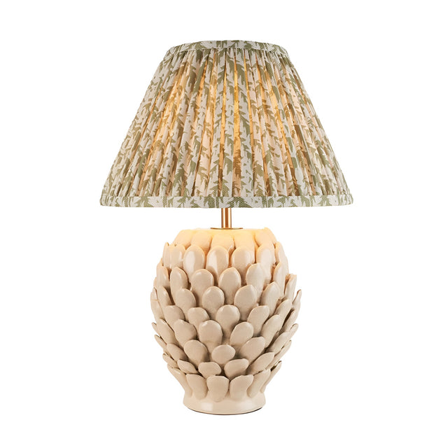 Endon Caldford table lamp with ivory crackle-glazed ceramic artichoke base and pleated green leaf-print fabric shade on a plain white background.
