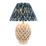 Caldford Ikat 30cm table lamp with cream crackle-glaze leaf-textured ceramic base, brass fittings, and pleated blue and cream patterned fabric shade.