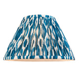 Caldford Ikat 30cm table lamp shade in blue, cream and natural ikat print fabric with pleated finish, shown against a plain white background.
