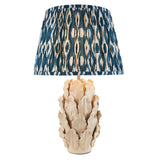 Endon Caldford Ikat 35cm table lamp with sculpted ivory ceramic leaf base and pleated blue and cream Ikat fabric shade on a white background.