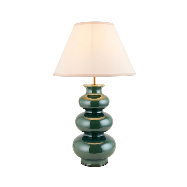 Carlstead Ivy Table Lamp in glossy green ceramic with tiered gourd-shaped base, brass fittings, and an ivory cotton-mix Ivy shade, shown on a white background.