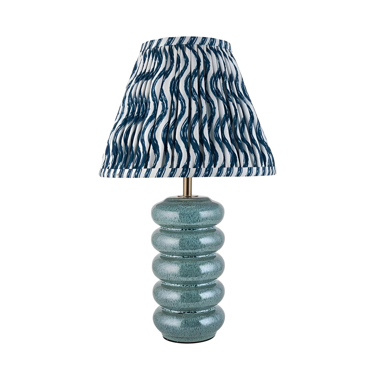 Cliffstead table lamp with ribbed blue reactive-glaze ceramic base, brass fitting, and pleated blue-and-white wave-print fabric shade.