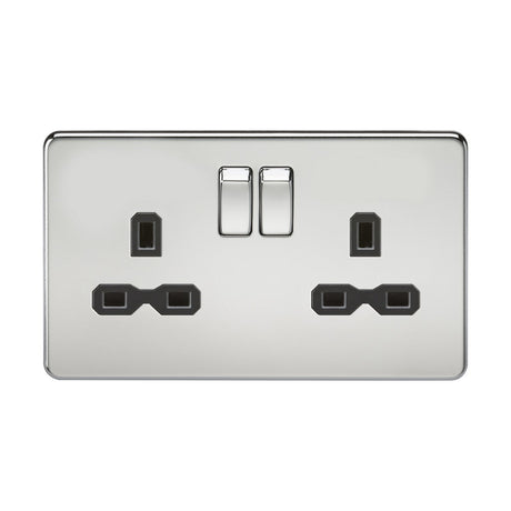 The 13A 2 Gang DP Switched Socket with Twin Earths, featuring a polished chrome finish and sleek black insert, offers a screwless design for UK plug types. Its shiny surface reflects light, providing a modern and elegant look.