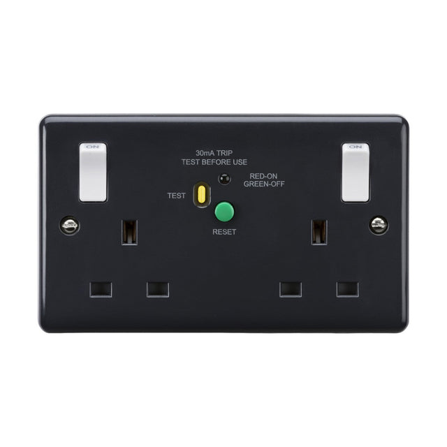 The 13A 2 Gang DP RCD Switched Socket with Outboard Rockers (Type-A) [Part M Compliant] from the Curved Edge range, featuring a dark finish and anti-microbial properties, includes two switches along with a central green and yellow button labeled Test and Reset. It also features a label indicating 30mA Trip and Test Before Use, making it an ideal addition to modern wiring accessories collections.