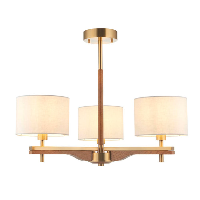 Bramwell 3-light semi-flush ceiling light with aged brass frame, oak arms and cream linen drum shades, on a plain white background.