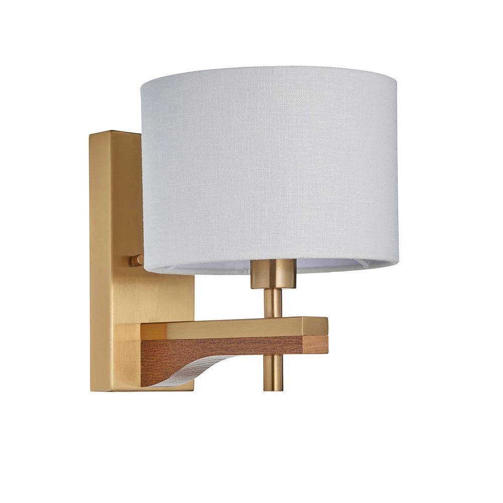 Endon Bramwell wall light with antique brushed brass fitting, oak-stained wood detail and natural faux-linen cylinder shade, on a white background.