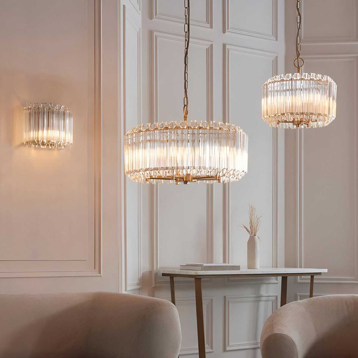 Endon Danebury 5 light pendant in aged brass with clear crystal rods, shown with matching wall light and smaller pendant in a panelled living room.