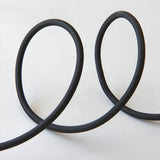 Endon Brackmont pendant flex set with black braided fabric cable looped in two curves on a plain white background.
