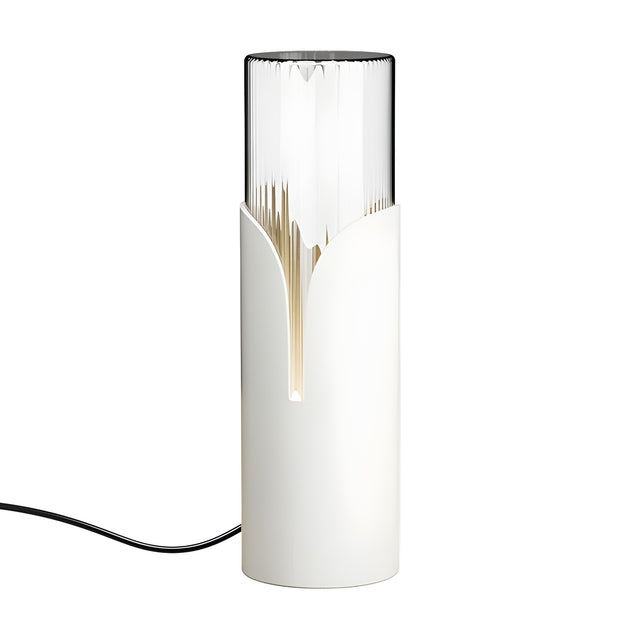 Bisel Cylinder Ribbed Glass Table Lamp in matt white iron with a tapering petal-cut sleeve, fluted clear glass top, and lit base seam, shown on a plain white background.