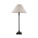 Endon Caldmont table lamp with slim matt black turned metal column, stepped square base and tapered natural linen shade on a plain background.