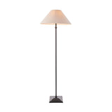 Endon Caldmere floor lamp with a tapered natural linen shade on a slim matt black metal stem and stepped square base, shown on a white background.