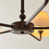 Close-up of the Endon Caldmere 5 Light Large Pendant in black, showing the matt black central hub, curved arms and a natural linen shade.