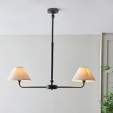 Endon Caldmere 2 Light Pendant in black with tapered natural linen shades on a linear bar and telescopic stem, shown against a pale wall.