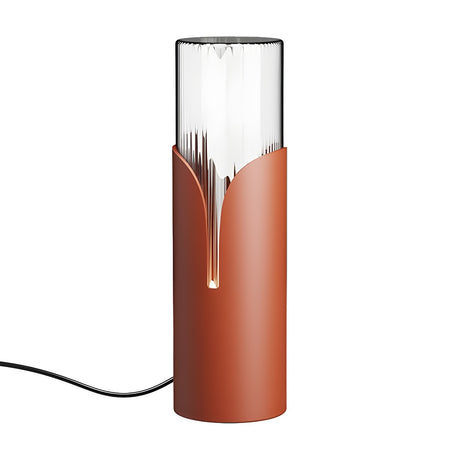 Bisel Cylinder Ribbed Glass Table Lamp in matt terracotta iron, with ribbed clear glass rising above a sleeve that parts in a narrow lit slit, shown on a plain white background.
