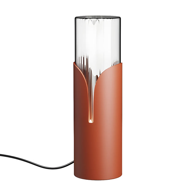 Bisel Cylinder Ribbed Glass Table Lamp in matt terracotta iron, with ribbed clear glass rising above a sleeve that parts in a narrow lit slit, shown on a plain white background.