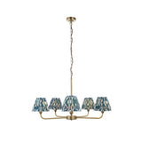 Endon Caldmere 5 light pendant with tapered pleated marlin blue ikat fabric shades on antique brass arms and chain, shown on a white background.