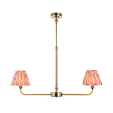 Endon Caldmere 2 light linear pendant in antique brass with two tapered coral pink ikat pleated shades on a telescopic stem, plain background.