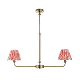 Endon Caldmere 2 light pendant with antique brass linear frame, telescopic stem and two tapered coral ikat pleated fabric shades on a white background.