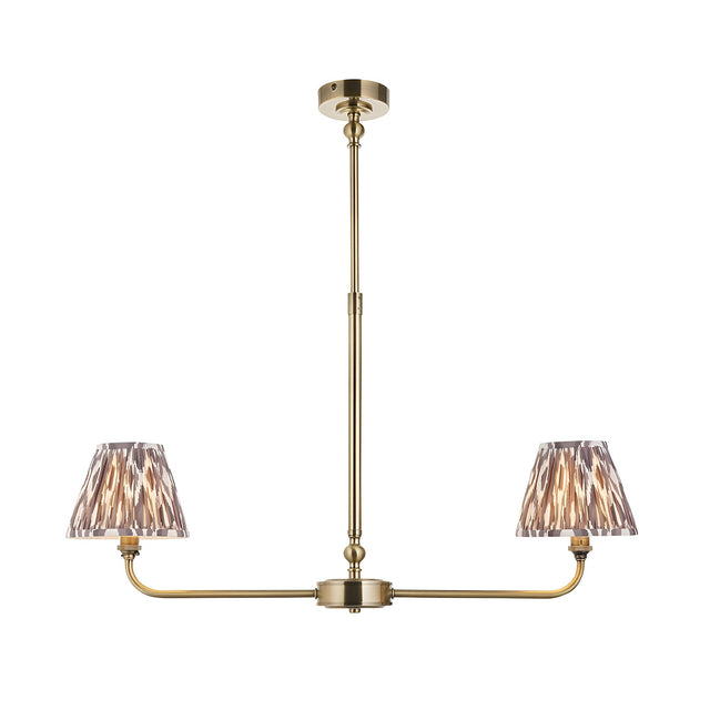 Caldmere 2 Light Ikat Pendant in antique brass with linear frame and two tapered grey pleated fabric shades, on a plain white background.