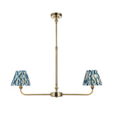 Endon Caldmere 2 light linear pendant in antique brass with two tapered pleated shades in marlin blue ikat print, on a plain white background.