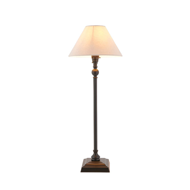 Endon Caldmont candlestick-style table lamp in matt black with a tapered natural linen shade and stepped square base, shown on a plain white background.