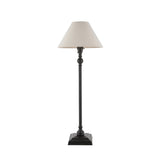 Endon Caldmont table lamp with slim matt black candlestick column, stepped square base and tapered natural linen shade on a plain background.