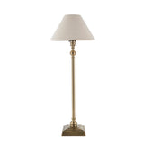 Endon Caldmont table lamp with a slim antique brass candlestick column, square stepped base and tapered natural linen shade, on a white background.
