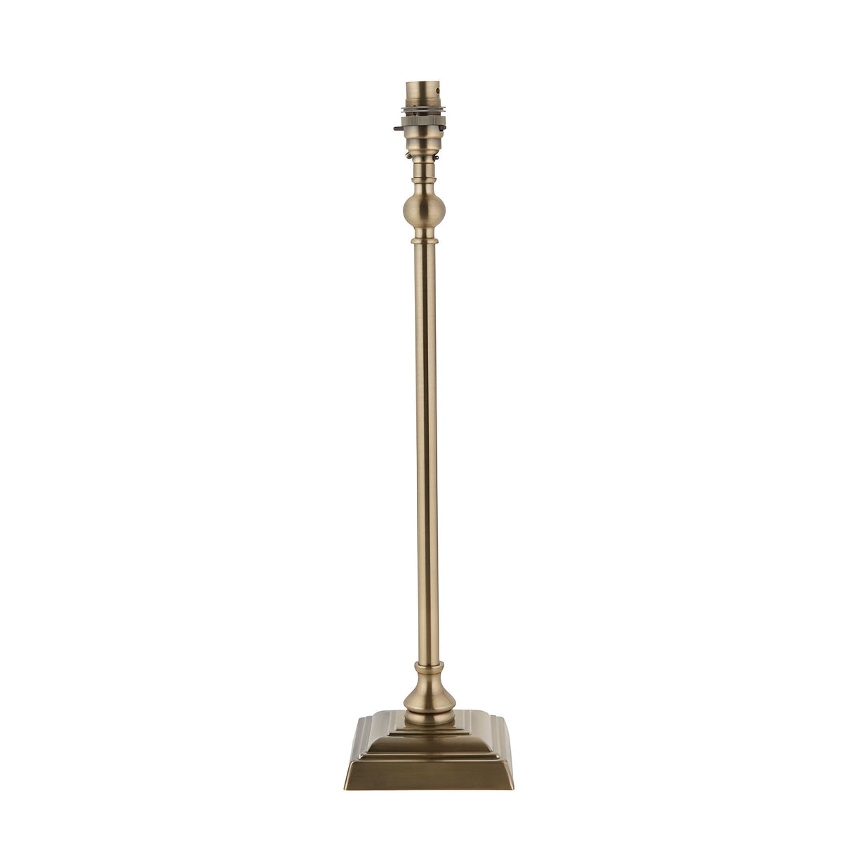 Caldmere table lamp base with slim turned candlestick-style stem, square foot in antique brass plate, and B22 holder, shown without shade on a white background.