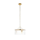 Brockhurst 3-light pendant in brass with a circular drum of clear textured glass panels, hung from a long chain on a white background.