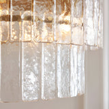 Close-up of Endon Brockhurst 5 Light Chandelier showing two tiers of handmade textured glass panels with brushed aged brass fittings.