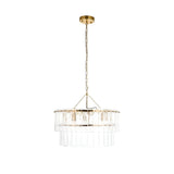 Endon Brockhurst 5 light chandelier with two tiers of textured glass panels and brushed aged brass frame, suspended from chain on a white background.