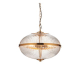 Langton 3 Light Pendant in brass with a ribbed two-part clear glass globe held by a brass band, hung from an adjustable chain on a white background.