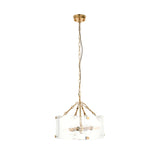 Brockmont 4 Light Pendant in brass, with a cylindrical shade of textured handmade glass panels on an adjustable chain, shown on a plain white background.
