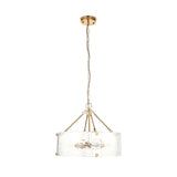 Endon Brockmont 6 light pendant with a rippled handmade glass cylinder shade and brushed aged brass frame on a chain, shown on a white background.