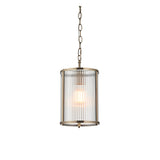 Endon Rothbury pendant light with a cylindrical ribbed clear glass shade in antique brass, suspended from a chain on a plain white background.