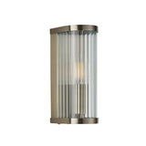 Endon Rothbury wall light with curved antique brass frame and vertically ribbed clear glass diffuser, single E14 candle bulb, shown on a white background.