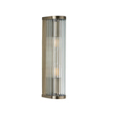 Rothbury 2 Light Wall Light in antique brass with ribbed clear glass diffusers, elongated curved frame, shown on a plain white background.